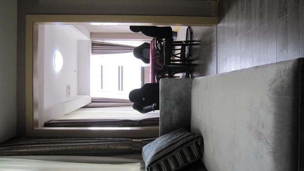 Sheng Jing Yi Jia Hotel Huji Bagian luar foto