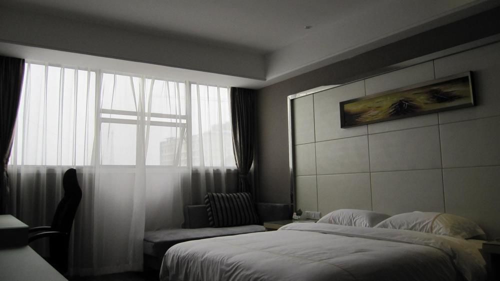 Sheng Jing Yi Jia Hotel Huji Bagian luar foto