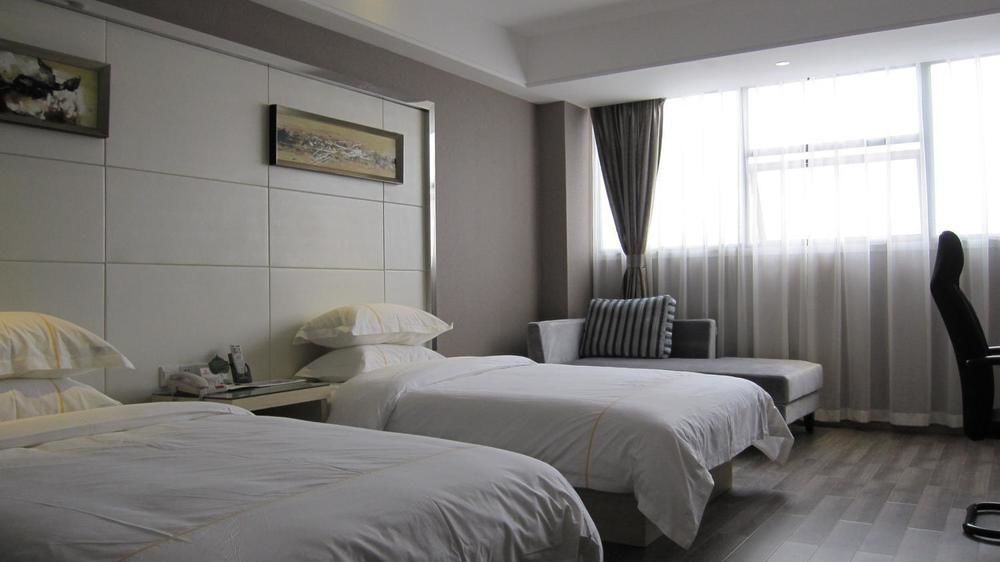 Sheng Jing Yi Jia Hotel Huji Bagian luar foto